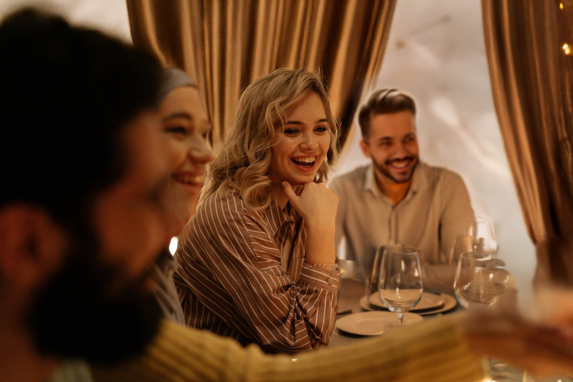 Friends at a Table Laughing