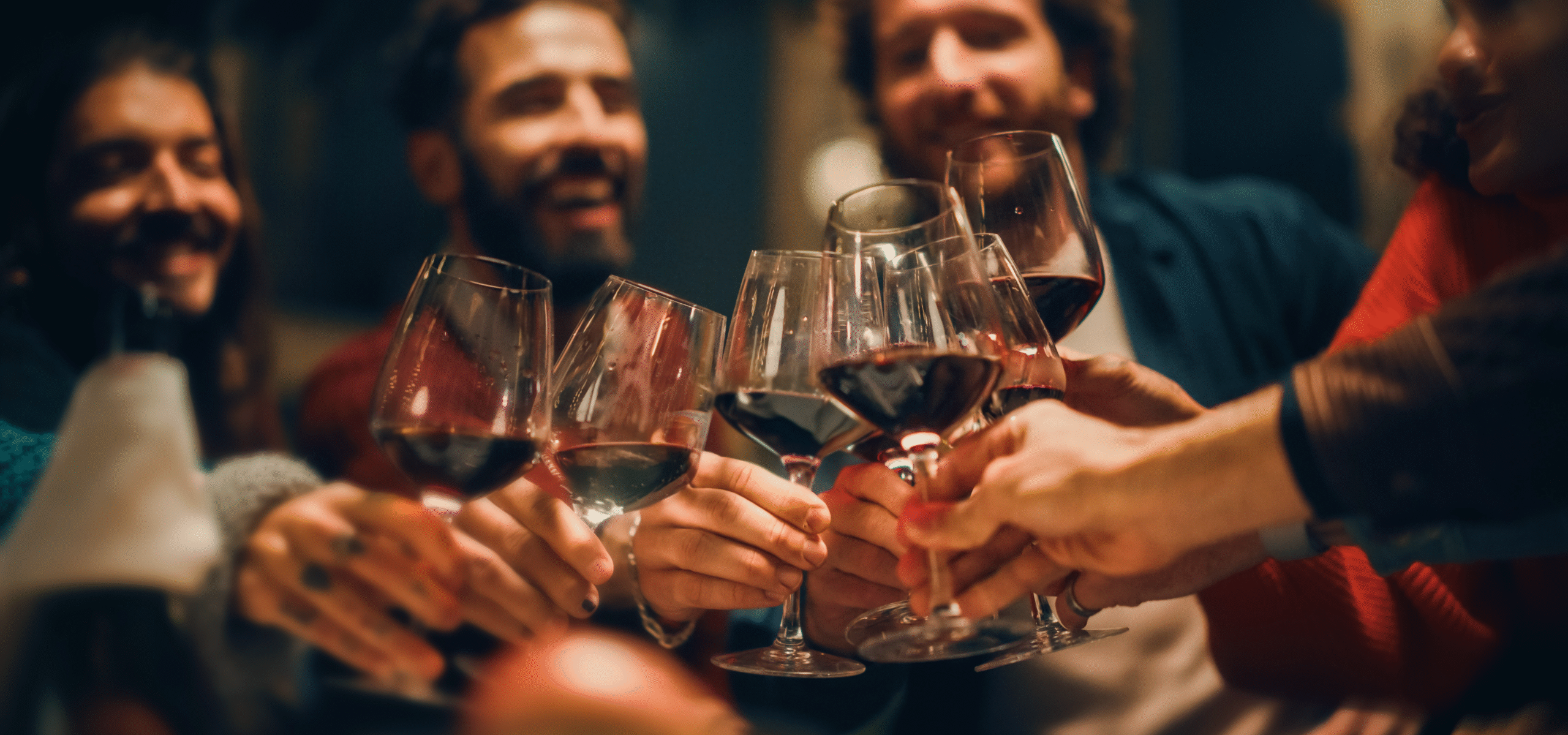 A group of friends enjoying red wine
