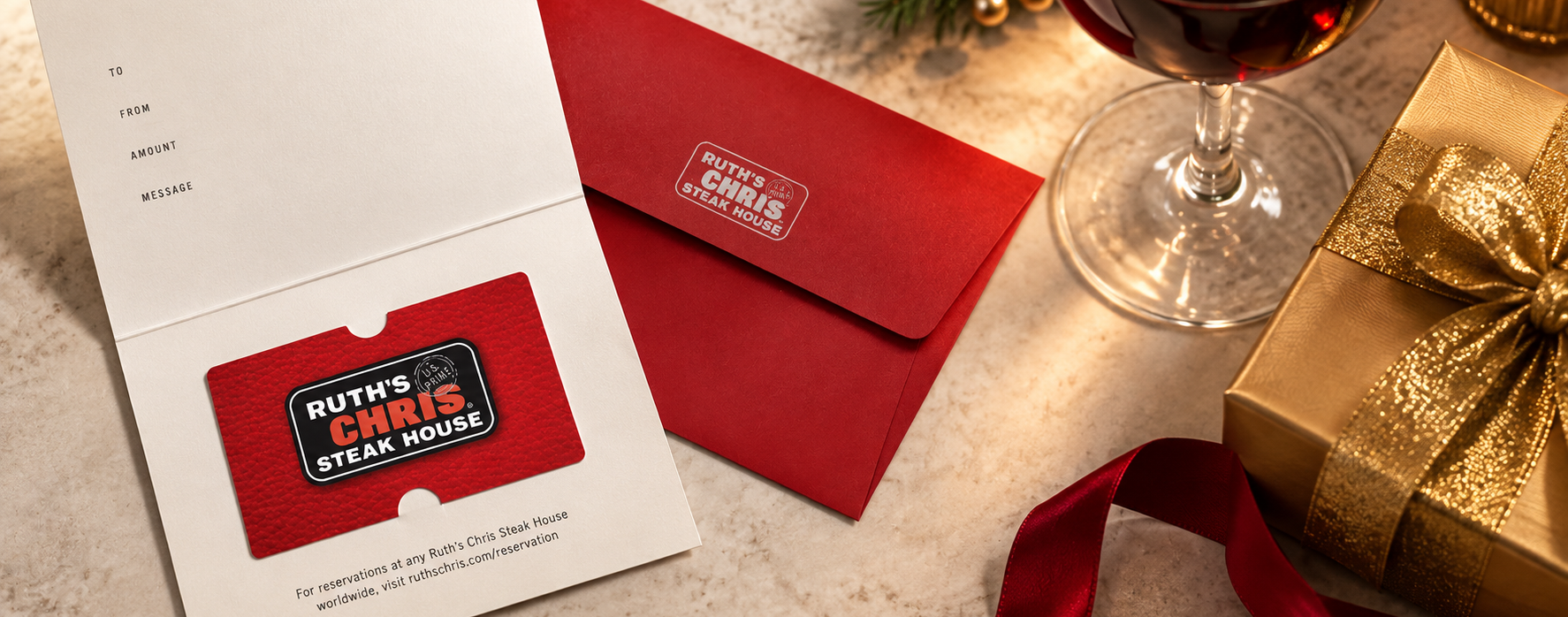 Ruth's Chris Gift Card and Red Envelope with gold gift box and a glass of wine