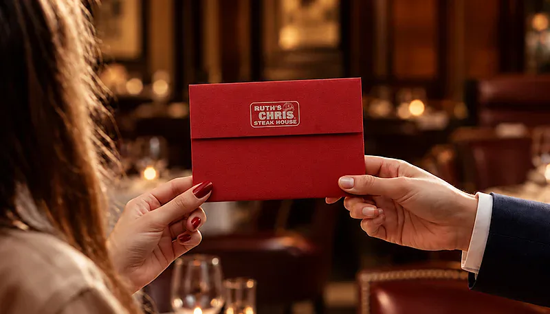 A couple holding a red envelope